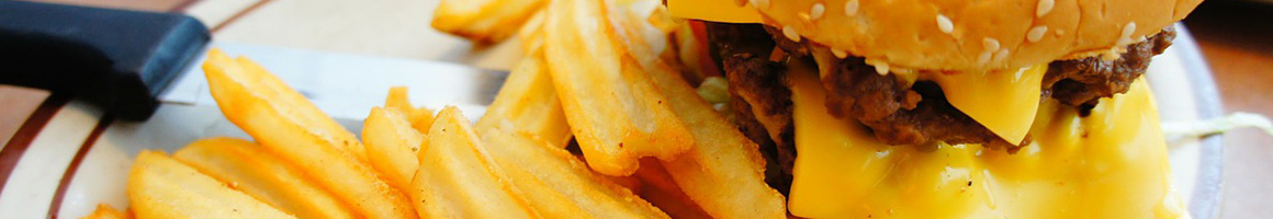 Eating Burger Chicken Wing Chicken Comfort Food at Sam's Chicken Land restaurant in Syracuse, NY.